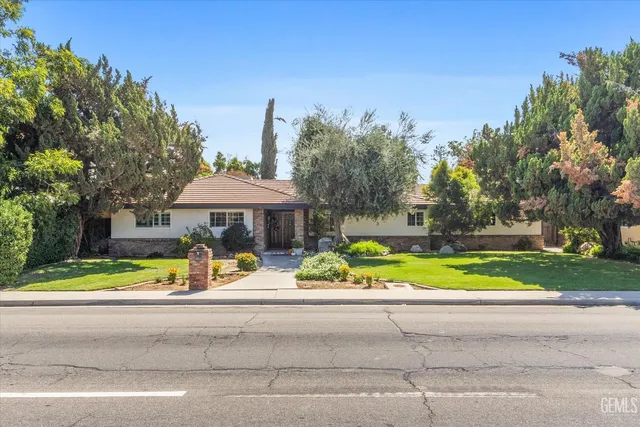 a view of street with houses and trees