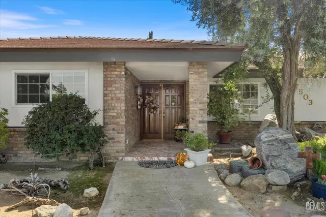 a view of a porch with furniture and a fire pit