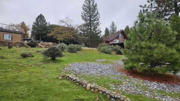 a backyard of a house with lots of green space