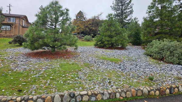 a view of a garden with a houses