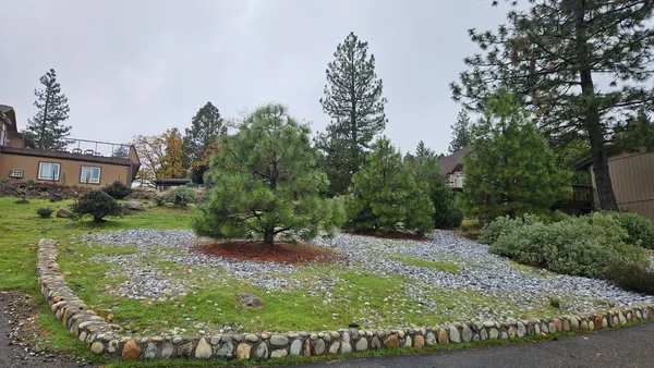 a backyard of a house with lots of green space