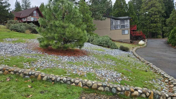 a backyard of a house with lots of green space