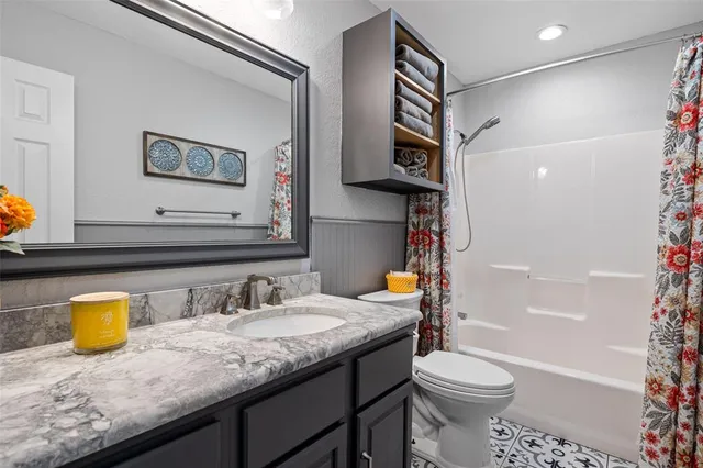 a hallway with wooden floor and entryway