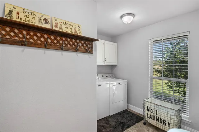 a view of a livingroom with furniture and front door