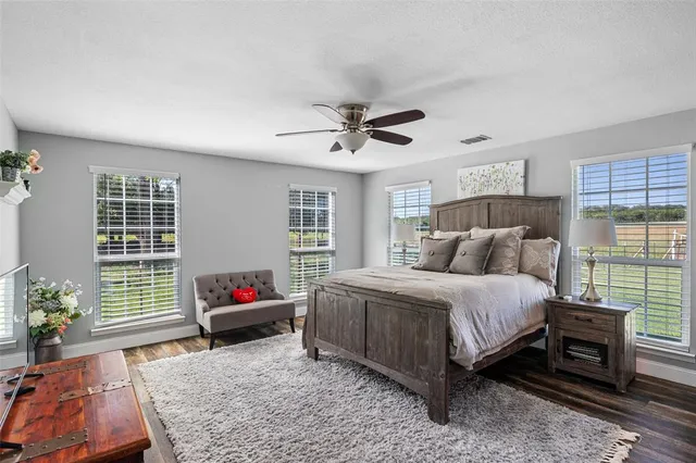 a utility room with dryer and window