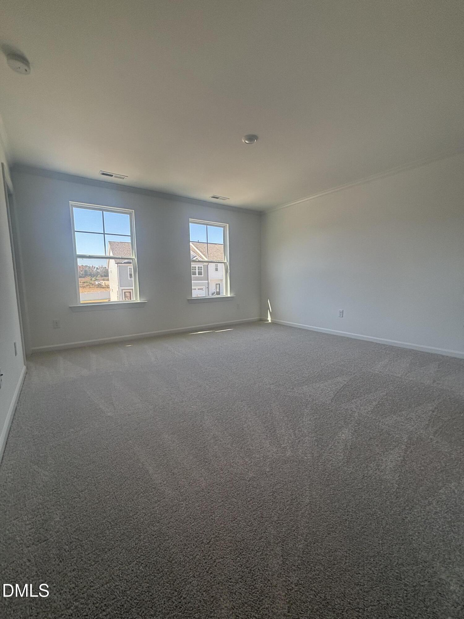 272 Hank Way Willow Spring, NC 27592 - Photo 12 of 19 an empty room with windows