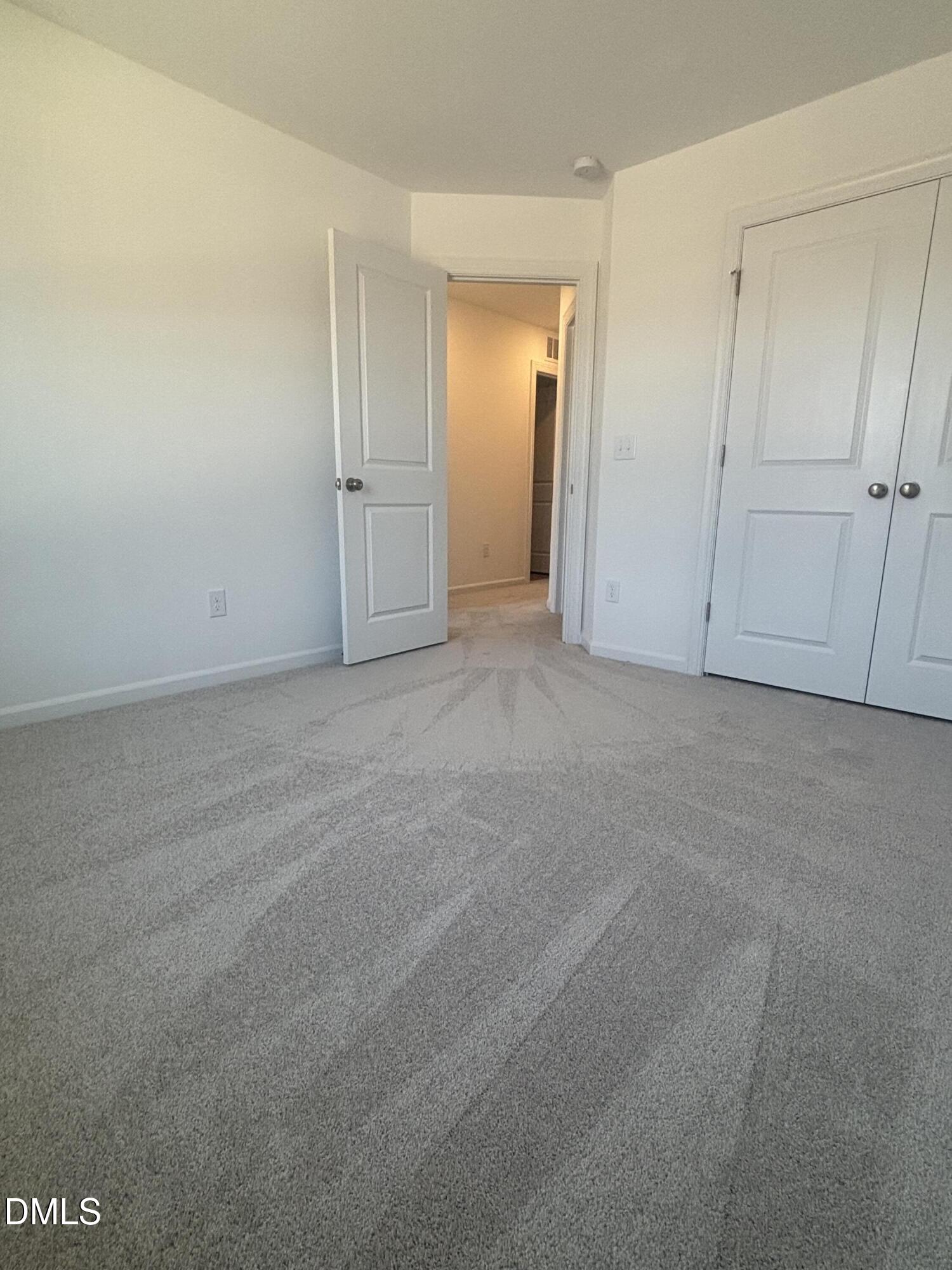 272 Hank Way Willow Spring, NC 27592 - Photo 18 of 19 an empty room with closet area