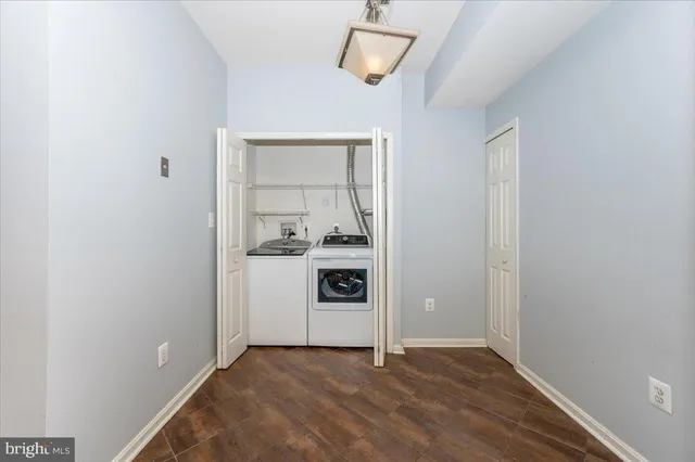 a big room with closet and wooden floor