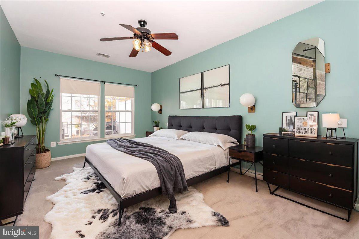1683 Fallowfield Court Crofton, MD 21114 - Photo 17 of 36 a bedroom with a bed mirror and a window