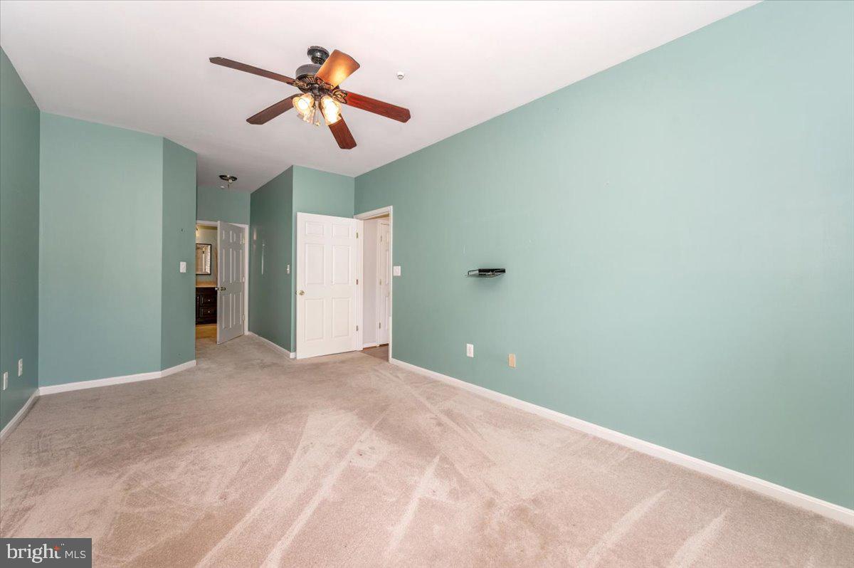 1683 Fallowfield Court Crofton, MD 21114 - Photo 19 of 36 a view of empty room with ceiling fan