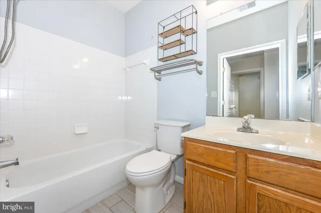 a view of a white house with a swimming pool