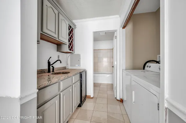 a kitchen with stainless steel appliances granite countertop a sink and cabinets
