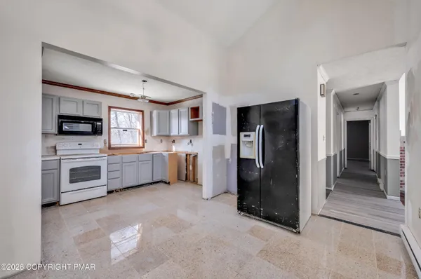 a kitchen with stainless steel appliances a refrigerator sink and stove
