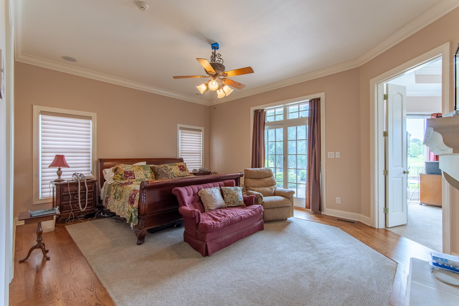 4265 Charlie Pounds Road Stantonville, TN 38379 - Photo 15 of 40 a spacious bedroom with a bed and a chandelier