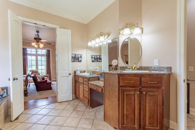 a bathroom with a sink a vanity and a mirror