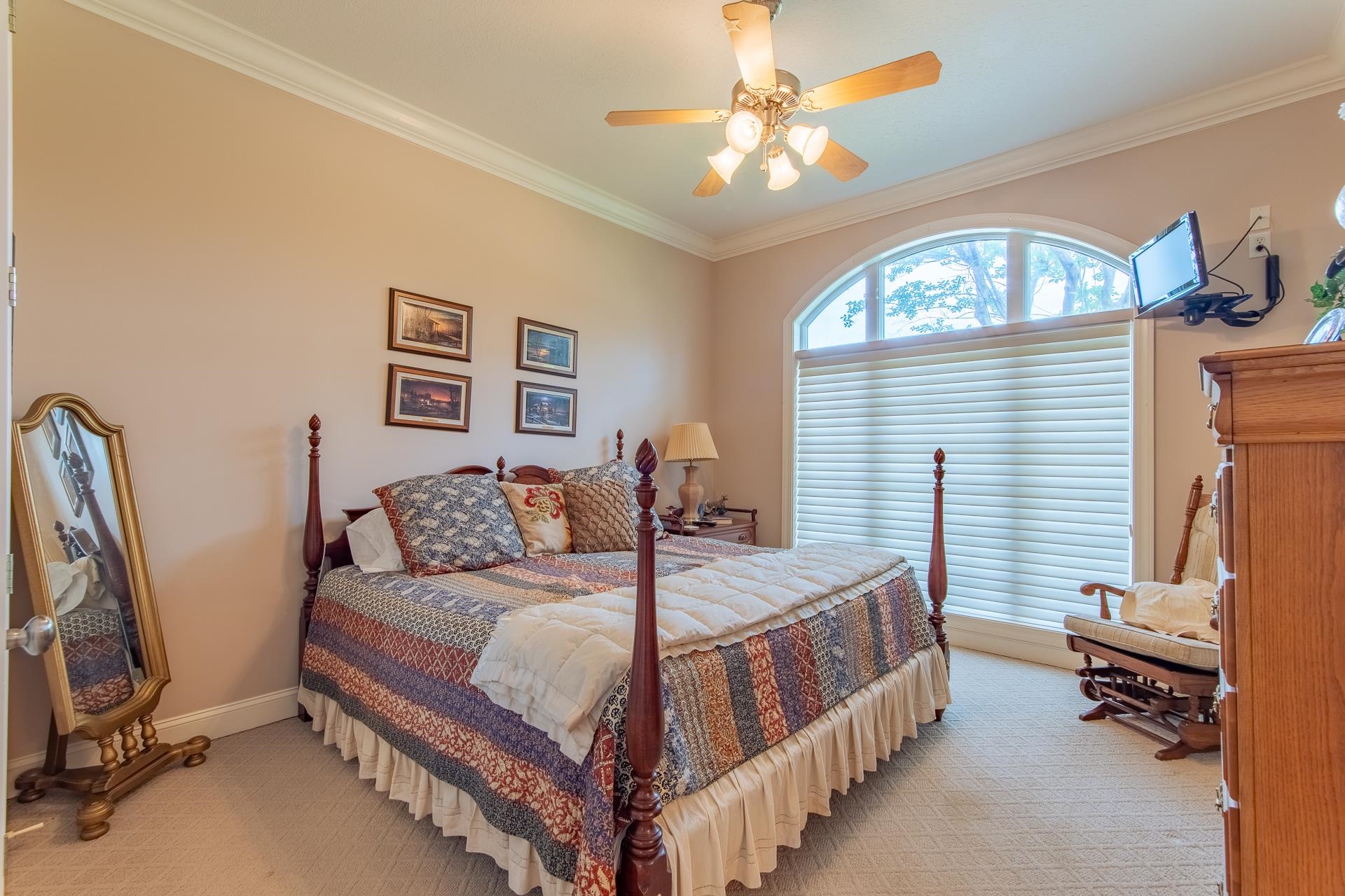 4265 Charlie Pounds Road Stantonville, TN 38379 - Photo 21 of 40 a bedroom with a bed a couch and a chandelier