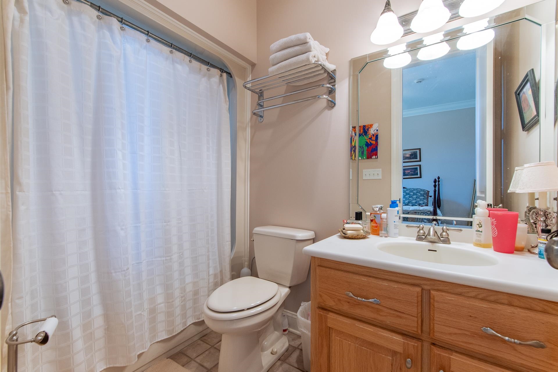 4265 Charlie Pounds Road Stantonville, TN 38379 - Photo 22 of 40 a bathroom with a sink a toilet and shower curtain