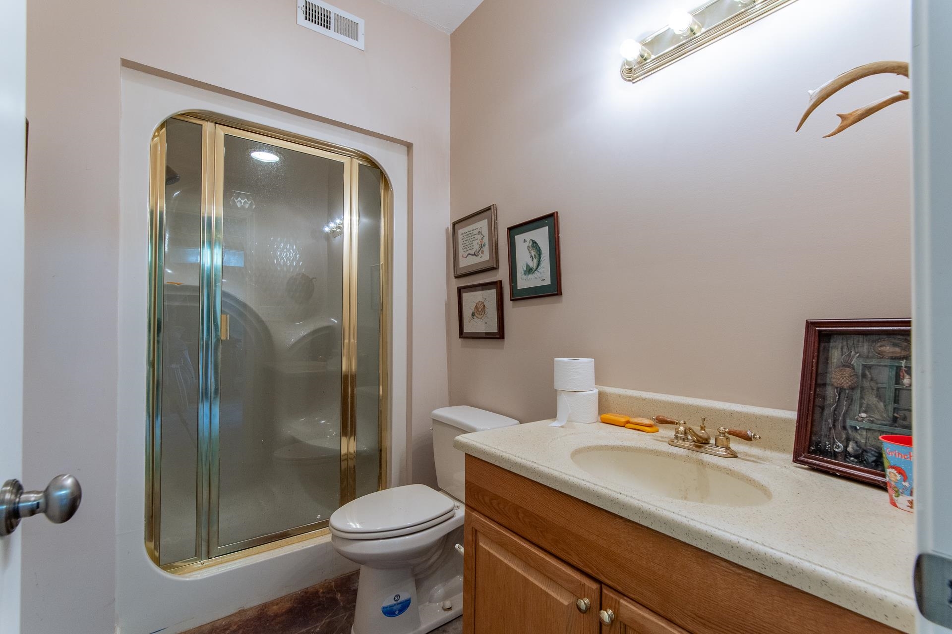4265 Charlie Pounds Road Stantonville, TN 38379 - Photo 30 of 40 a bathroom with a sink a toilet and shower