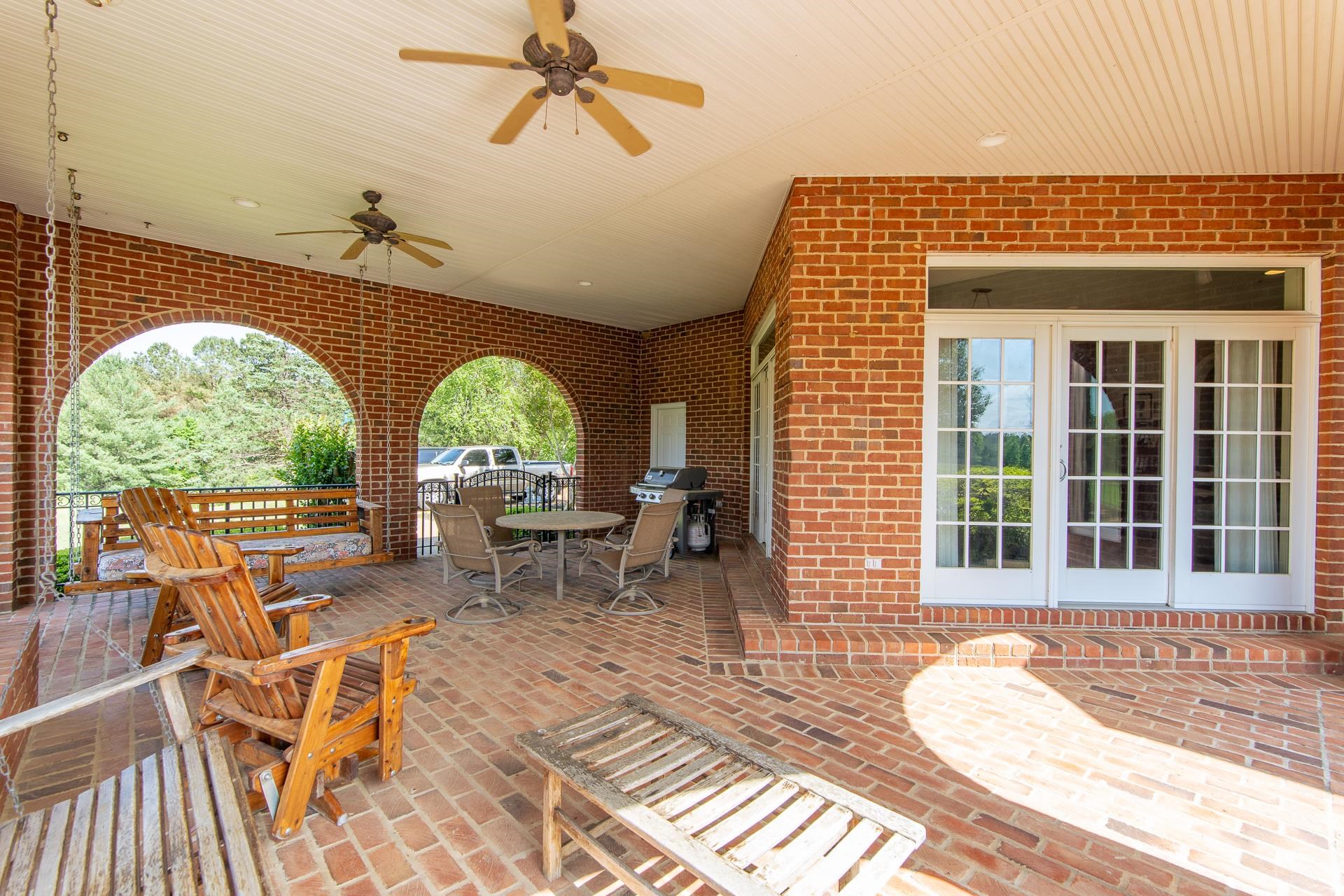 4265 Charlie Pounds Road Stantonville, TN 38379 - Photo 35 of 40 a view of a balcony with dining table and chairs