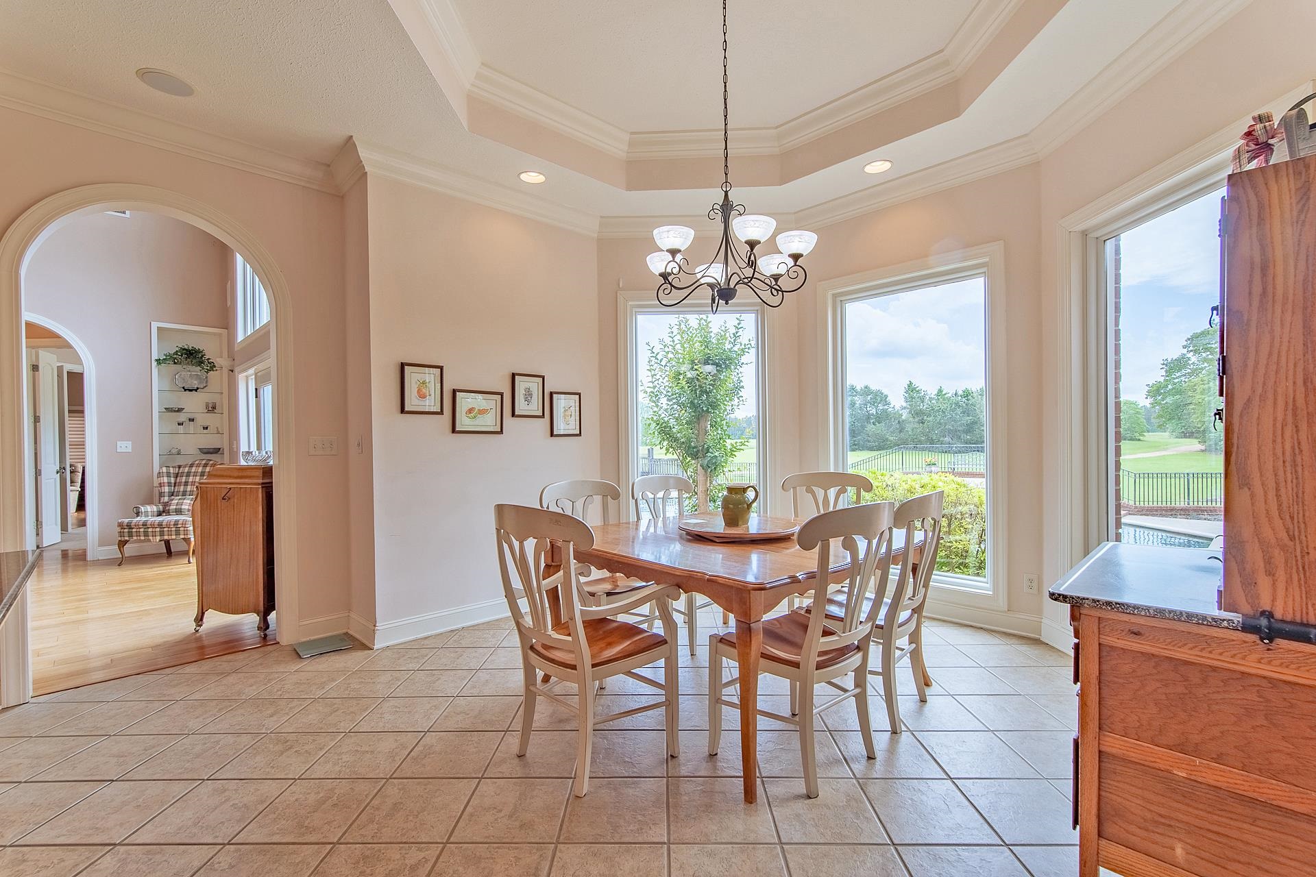 4265 Charlie Pounds Road Stantonville, TN 38379 - Photo 6 of 40 a view of a dining room with furniture large windows and wooden floor