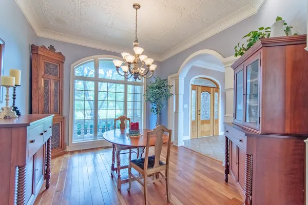 a living room with furniture kitchen view and a fireplace