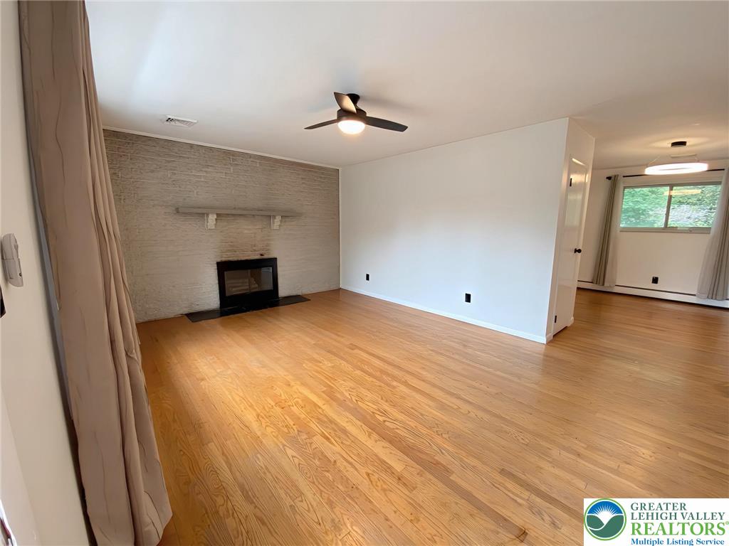 1522 Clearfield Road Wind Gap, PA 18091 - Photo 8 of 48 wooden floor in an empty room with a window
