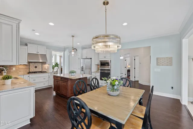 a view of a hallway with entryway and stairs
