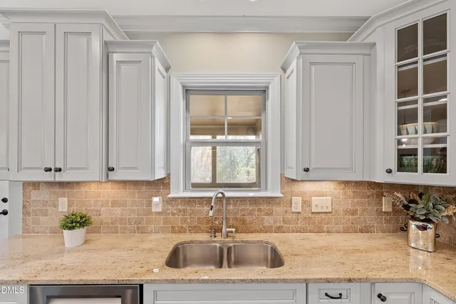 a bedroom with a bed and a cabinets