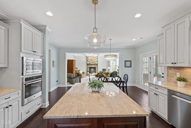 a spacious bathroom with a granite countertop sink a mirror and a shower