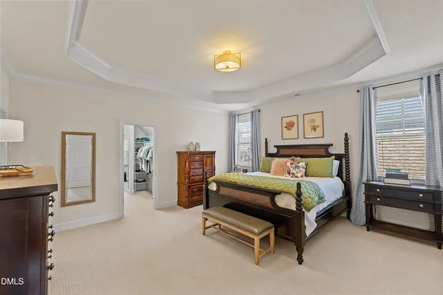 a room with furniture pool table and windows