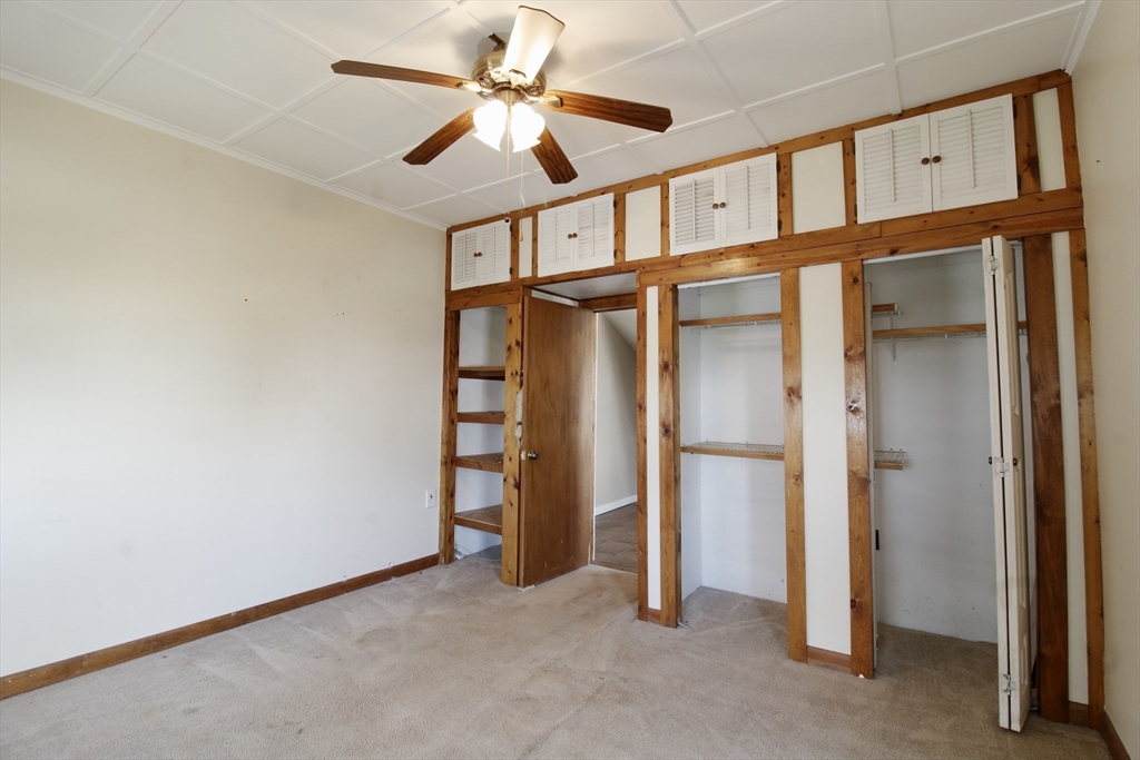 100 Ridge Street Fall River, MA 02721 - Photo 14 of 22 an empty room with closet and a ceiling fan