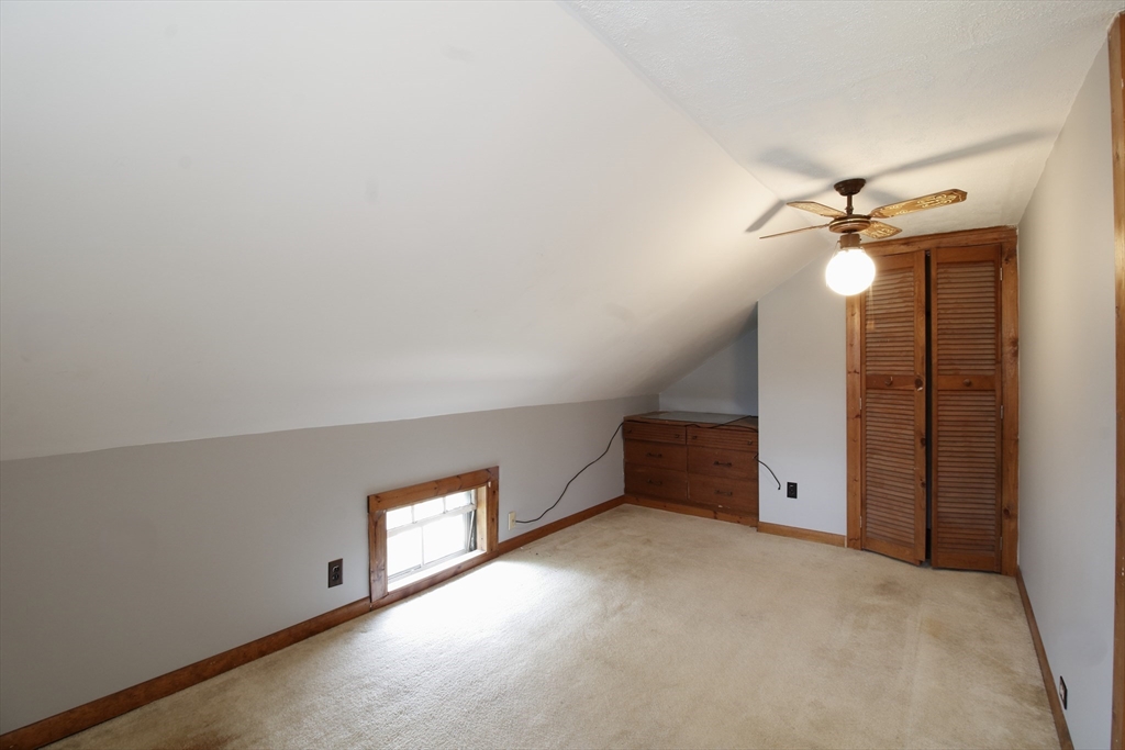 100 Ridge Street Fall River, MA 02721 - Photo 17 of 22 an empty room with a ceiling fan and a window