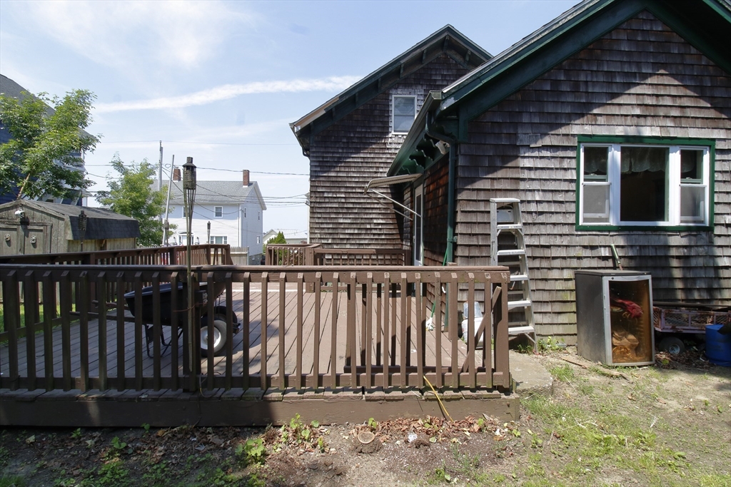 100 Ridge Street Fall River, MA 02721 - Photo 5 of 22 a view of a house with wooden deck