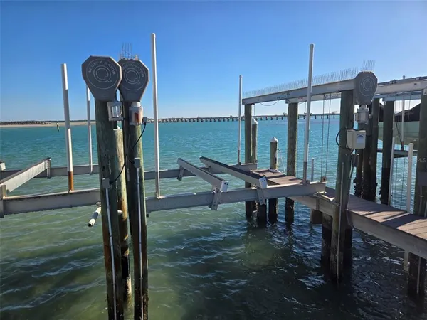 a view of a patio with table and chairs