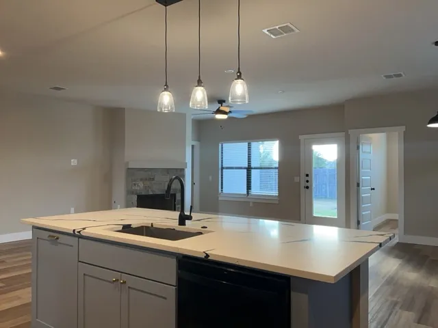 a kitchen with a sink and a refrigerator