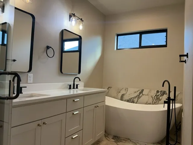 a bathroom with a shower and a sink