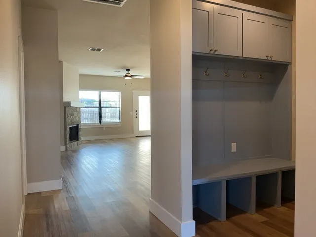 a view of livingroom with hardwood floor and hallway