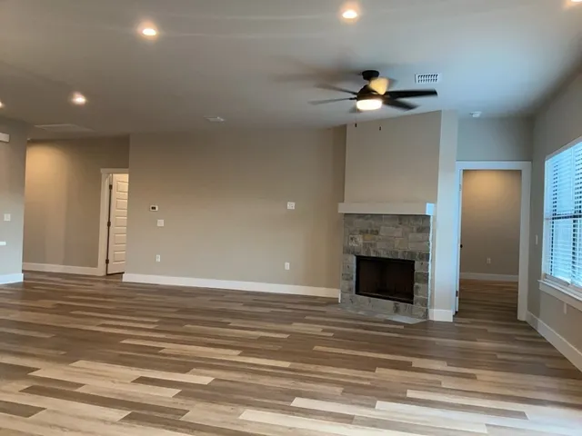a view of a livingroom and a fireplace