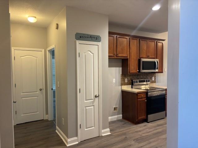 50 Blue Grass Way Oxford, GA 30054 - Photo 11 of 36 a kitchen with stainless steel appliances granite countertop a refrigerator and a stove top oven