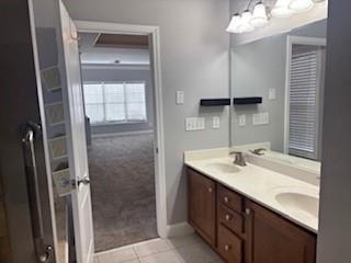 50 Blue Grass Way Oxford, GA 30054 - Photo 15 of 36 a bathroom with a sink double vanity and a mirror