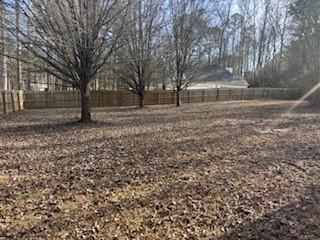 50 Blue Grass Way Oxford, GA 30054 - Photo 25 of 36 a backyard of a house with lots of green space