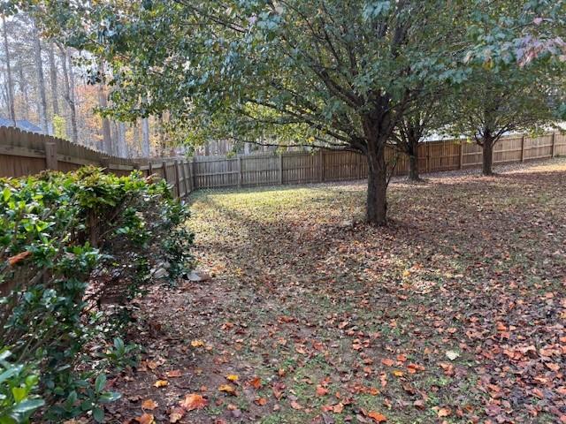 50 Blue Grass Way Oxford, GA 30054 - Photo 27 of 36 a view of backyard with tree