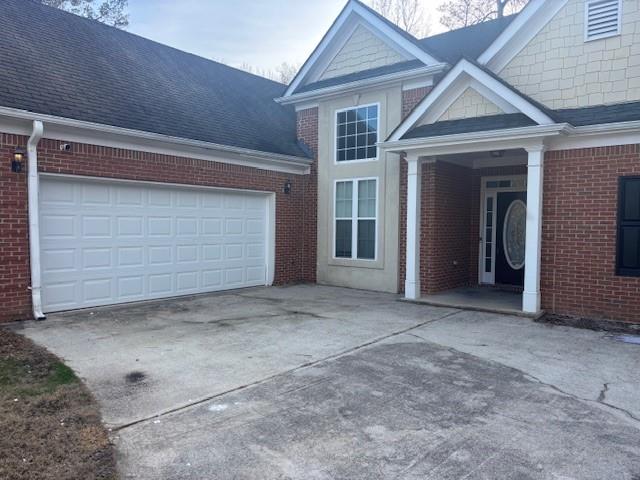 50 Blue Grass Way Oxford, GA 30054 - Photo 32 of 36 a view of house with garage