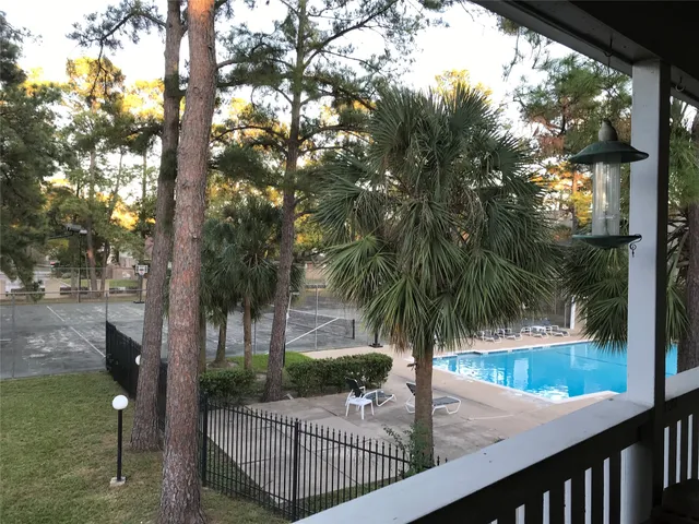 a view of swimming pool from a balcony