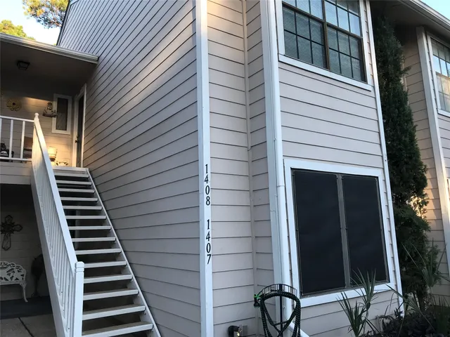 a view of a balcony with staircase
