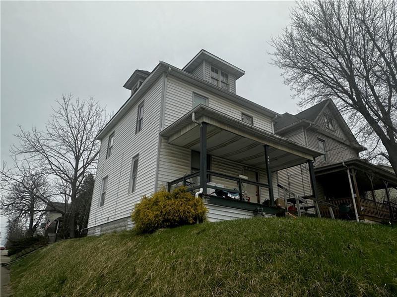 801 Butler Avenue New Castle, PA 16101 - Photo 2 of 8 a view of a house with backyard and garden