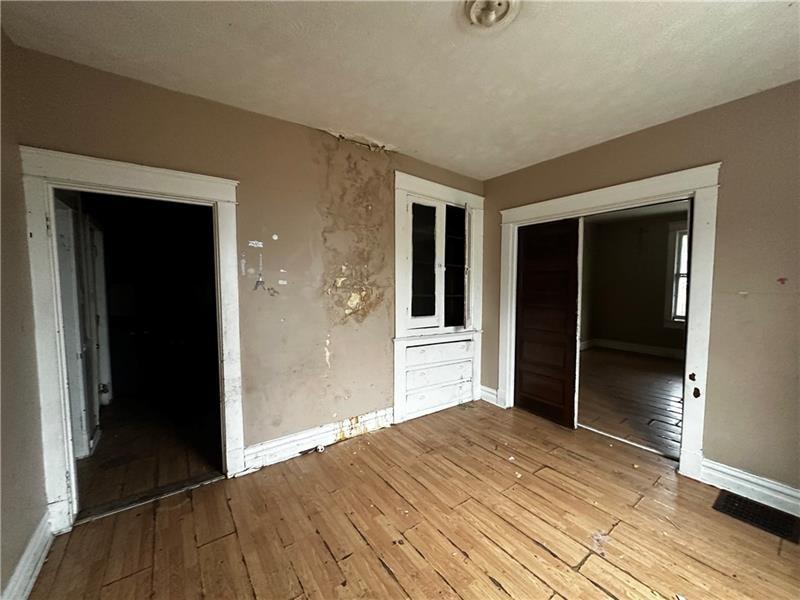801 Butler Avenue New Castle, PA 16101 - Photo 3 of 8 wooden floor and window in a room