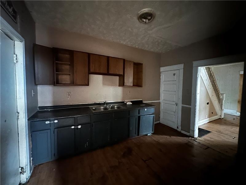801 Butler Avenue New Castle, PA 16101 - Photo 5 of 8 a kitchen with stainless steel appliances granite countertop a refrigerator and a stove