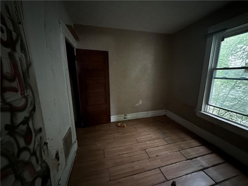801 Butler Avenue New Castle, PA 16101 - Photo 8 of 8 a view of an empty room with a window