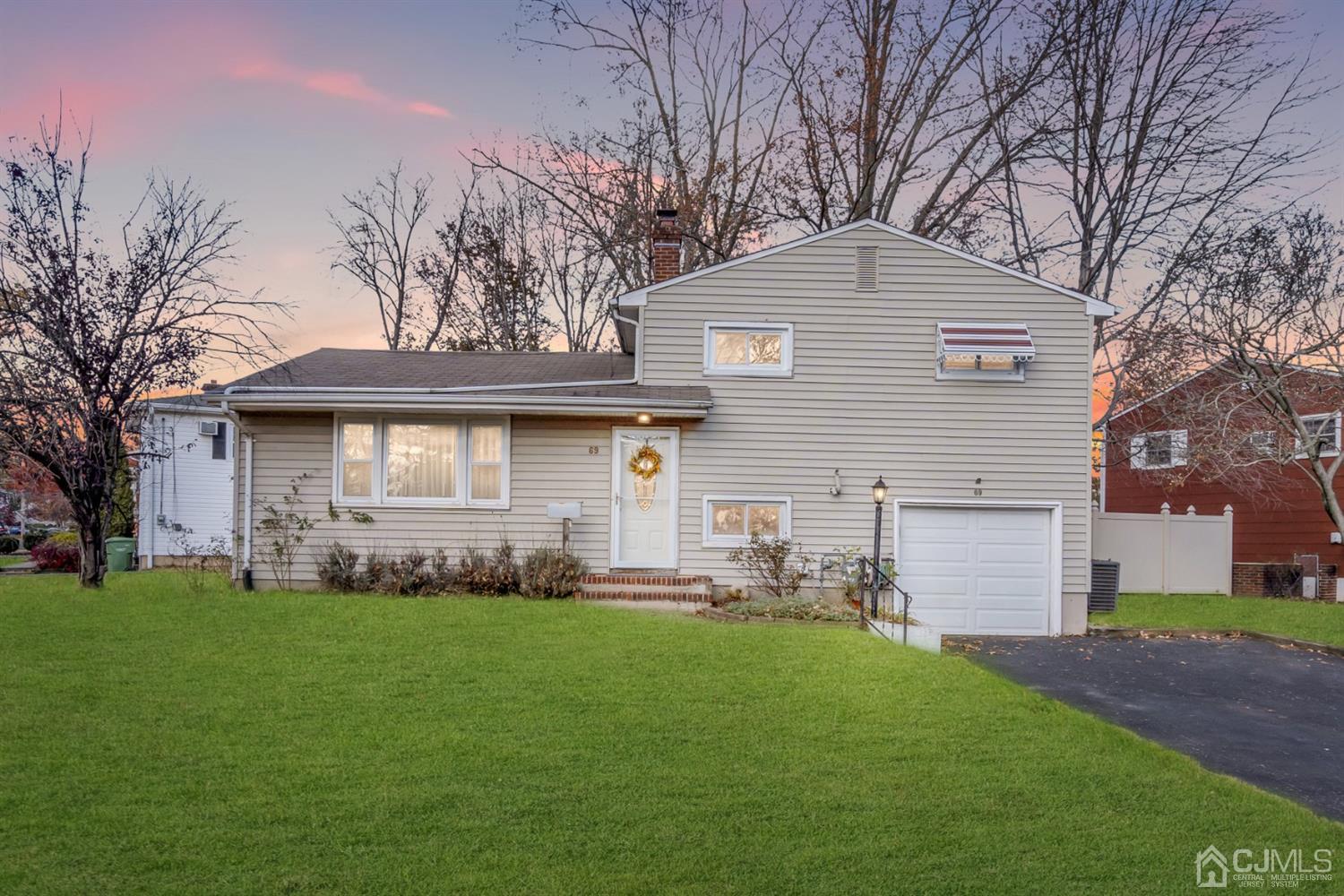 69 Stony Road Edison, NJ 08817 - Photo 1 of 33 a front view of house with yard and green space